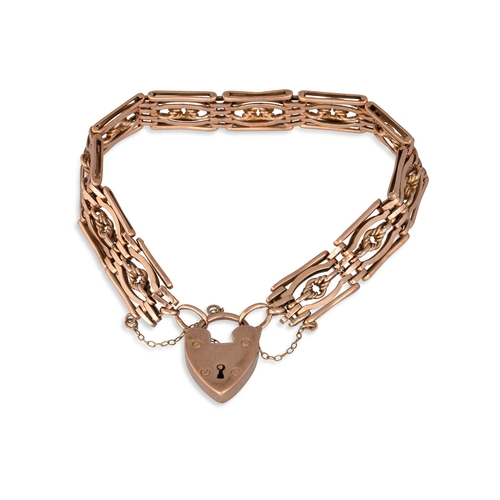 8 - AN ANTIQUE GOLD GATE BRACELET, with padlock clasp and safety chain, 21 g.