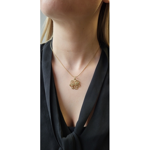 114 - A DIAMOND SET PENDANT AND CHAIN, applied motifs with butterflies, in 14ct yellow gold. Estimated: we... 