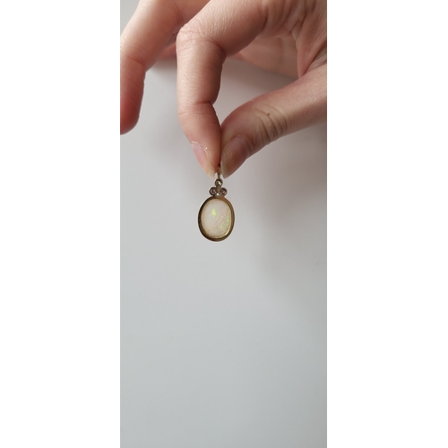 118 - AN OPAL AND DIAMOND PENDANT, mounted in 14ct yellow gold. Estimated: weight of diamonds: 0.15 ct, op... 