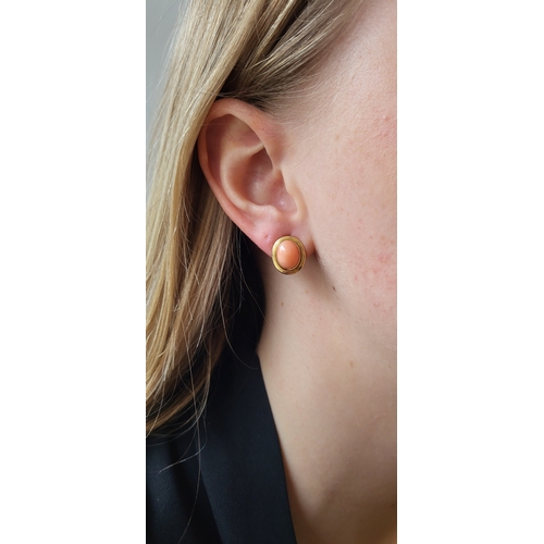 119 - A PAIR OF CORAL STUD EARRINGS, to 18ct yellow gold surrounds