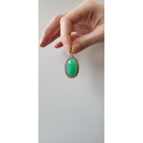 121 - A DIAMOND AND CHRYSOPRASE CLUSTER PENDANT, the oval chrysoprase to diamond surround, mounted in 14ct... 