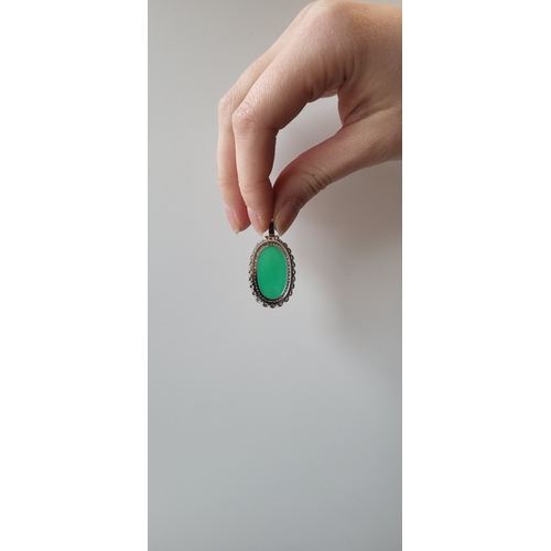 121 - A DIAMOND AND CHRYSOPRASE CLUSTER PENDANT, the oval chrysoprase to diamond surround, mounted in 14ct... 