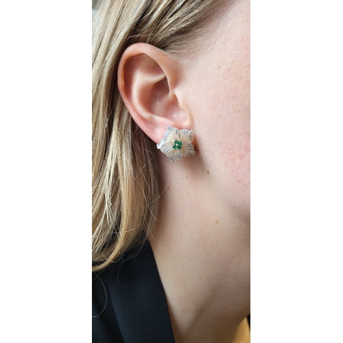 143 - A PAIR OF MOTHER-OF-PEARL AND EMERALD FLORAL CLUSTER EARRINGS, mounted in white gold