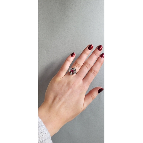 221 - A RUBY AND DIAMOND PLAQUE RING, mounted in 18ct white gold. Estimated: weight of ruby: 0.80 ct, diam... 