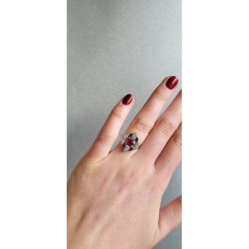 221 - A RUBY AND DIAMOND PLAQUE RING, mounted in 18ct white gold. Estimated: weight of ruby: 0.80 ct, diam... 