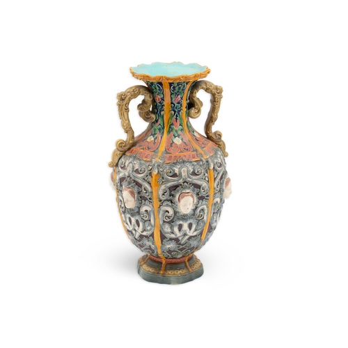 428 - AN ANTIQUE COPELAND TWIN HANDLED VASE, with moulded polychrome decoration, ca 11.5