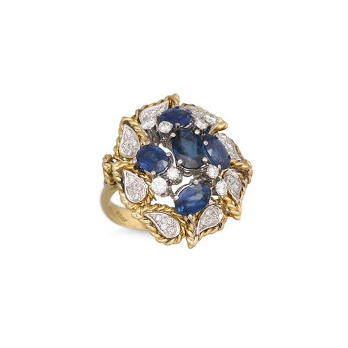 173 - A VINTAGE SAPPHIRE AND DIAMOND CLUSTER RING, the central sapphire cluster to a pavé diamond set surr... 