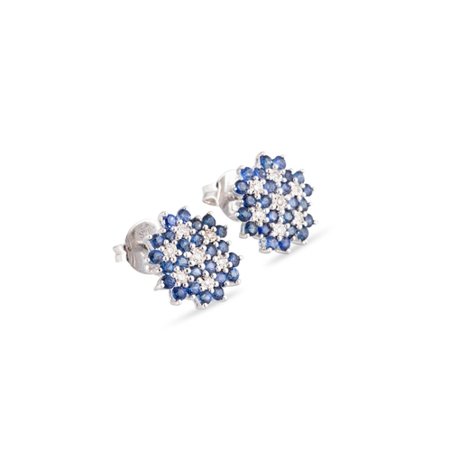 11 - A PAIR OF SAPPHIRE AND DIAMOND CLUSTER EARRINGS, mounted in 9ct white gold