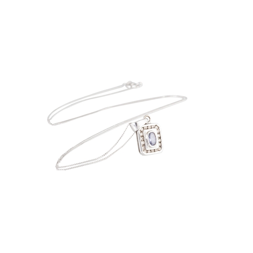 19 - A TANZANITE AND DIAMOND SET PENDANT, the central oval tanzanite to diamond set surround mounted in 9... 