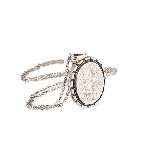 24 - A VINTAGE SILVER/COMPOSITE LOCKET, to a white metal chain. The locket testing as 91% silver to a cop... 