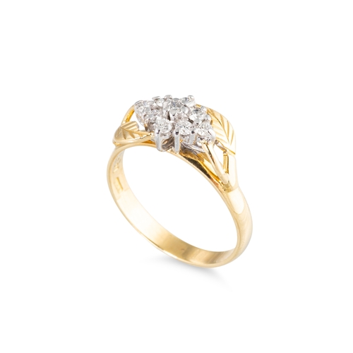 29 - AN IRISH DESIGNER RING, clusters of diamonds flanked by stylised leaf design to an 18ct yellow gold ... 