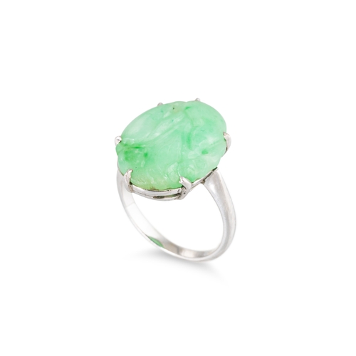 35 - A JADE SET RING, mounted in platinum, size