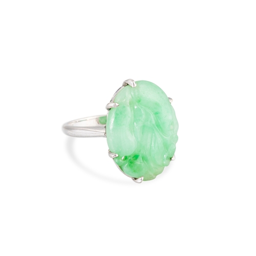 35 - A JADE SET RING, mounted in platinum, size