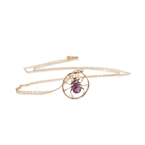 395 - AN ANTIQUE INSECT PENDANT, modelled as a spider, set with amethyst, stamped 9ct on a 9ct gold chain
