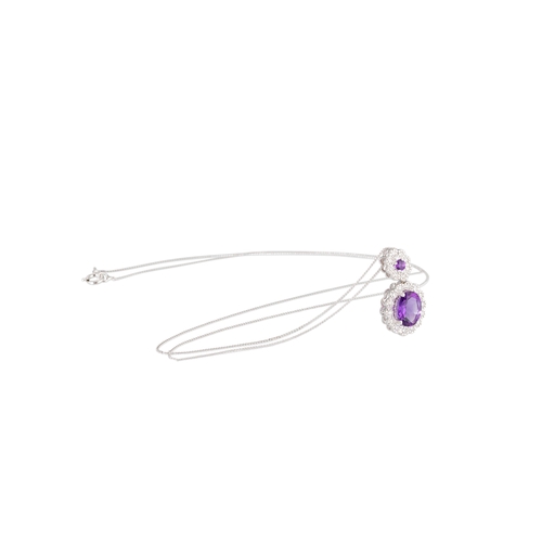 41 - AN AMETHYST AND DIAMOND SET CLUSTER PENDANT, the round amethyst to diamond set surround suspending a... 