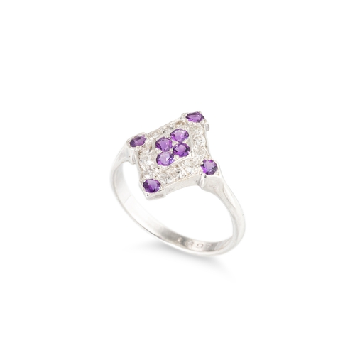 47 - AN AMETHYST AND DIAMOND SET CLUSTER RING, of plaque form mounted in silver. Estimated: weight of ame... 