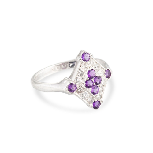 47 - AN AMETHYST AND DIAMOND SET CLUSTER RING, of plaque form mounted in silver. Estimated: weight of ame... 