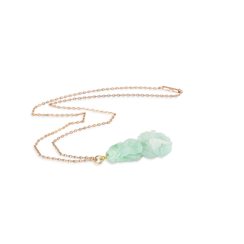 49 - A CARVED JADE PENDANT, with a 9ct gold chain & barrel clasp, chain 18