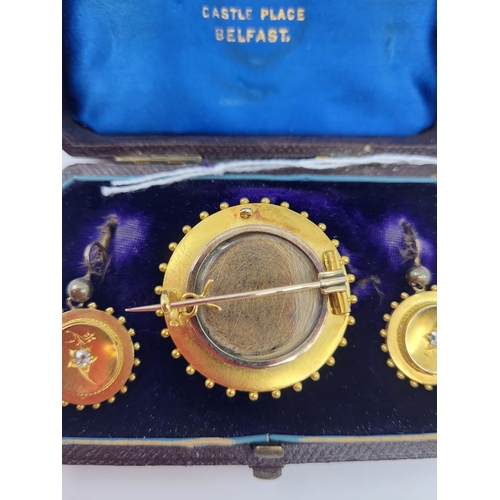 148 - AN ANTIQUE SUITE OF A DIAMOND SET BROOCH AND EARRINGS, mounted in gold, shepherd hook fittings, fitt... 