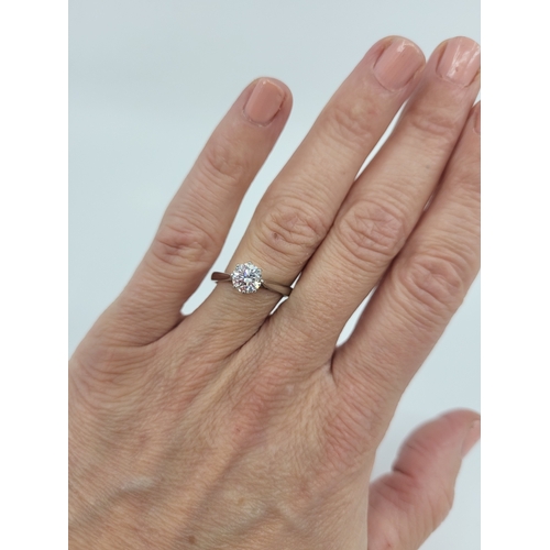 25 - A DIAMOND SOLITAIRE RING, the round brilliant cut diamond to an 18ct white gold mount. Estimated: we... 