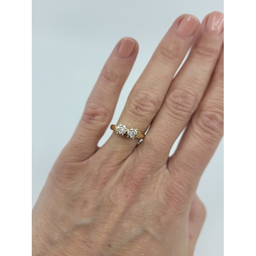 30 - AN IRISH DIAMOND TWO-STONE DRESS RING, high illusion setting, mounted in 18ct yellow gold, by O'Conn... 