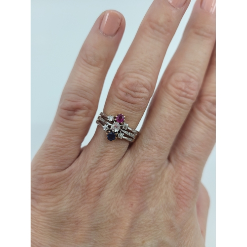 373 - AN ANTIQUE RUBY, SAPPHIRE AND DIAMOND CLUSTER RING, to diamond shoulders, mounted in 18ct yellow gol... 