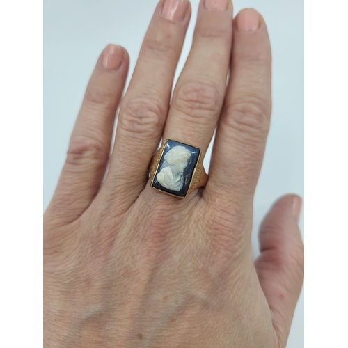 42 - AN ANTIQUE INTAGLIO SET RING, the intaglio depicting a profile of a lady mounted in 9 ct gold, with ... 