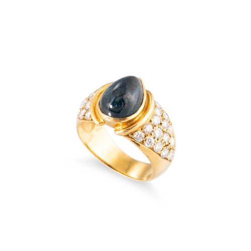 101 - A VINTAGE SAPPHIRE AND DIAMOND CLUSTER RING, the central pear cut cabochon sapphire to diamond set s... 