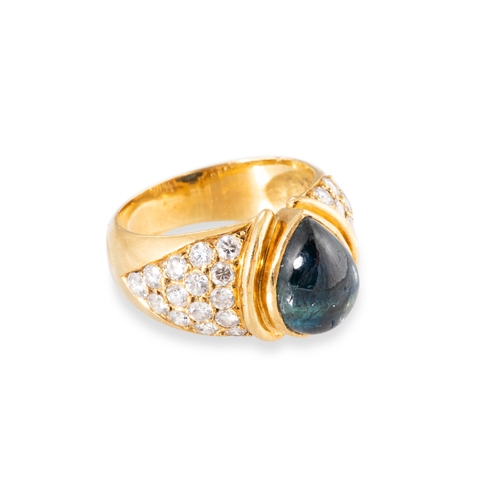 101 - A VINTAGE SAPPHIRE AND DIAMOND CLUSTER RING, the central pear cut cabochon sapphire to diamond set s... 