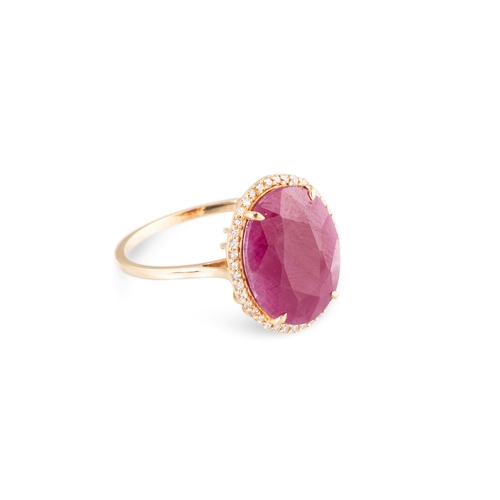 103 - A RUBY AND DIAMOND SET CLUSTER RING, the central oval ruby to diamond set surround, mounted in 14ct ... 