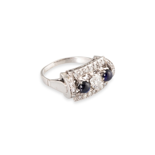 104 - A RETRO DIAMOND AND SAPPHIRE SET CLUSTER RING, the central trio of diamonds flanked by two cabochon ... 