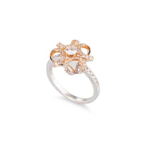 111 - A DIAMOND SET CLUSTER RING, unusual openwork form in white and yellow 18ct gold. Estimated: weight o... 