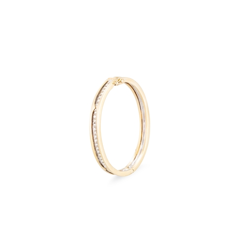 114 - A DIAMOND SET BANGLE, the round brilliant cut diamonds mounted in 14ct white and yellow gold. Estima... 