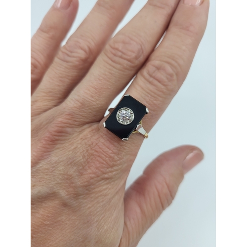 62 - AN ART DECO ONYX AND DIAMOND PLAQUE RING, mounted in 18ct yellow gold and palladium, size S-T