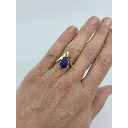 72 - A 1970S DESIGNER RING, set with lapis lazuli, mounted in 14ct yellow gold, gross weight 5 g.,