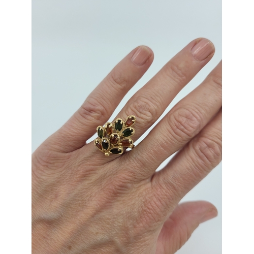 80 - A VINTAGE CLUSTER RING, of naturalistic form, set with orange and green stones, mounted in 14ct yell... 