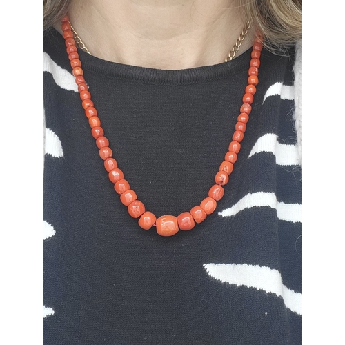 95 - A MEDITERRANEAN CORAL BEADED NECKLACE, the graduated red coral beads to a coral set 18ct gold clasp