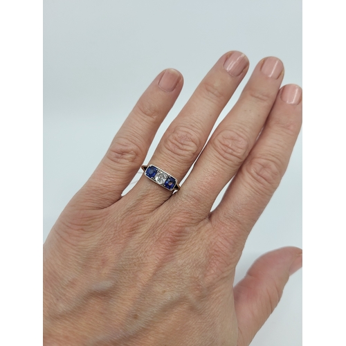 96 - AN ANTIQUE SAPPHIRE AND DIAMOND THREE-STONE RING, set with an old cut diamond and cushion cut sapphi... 