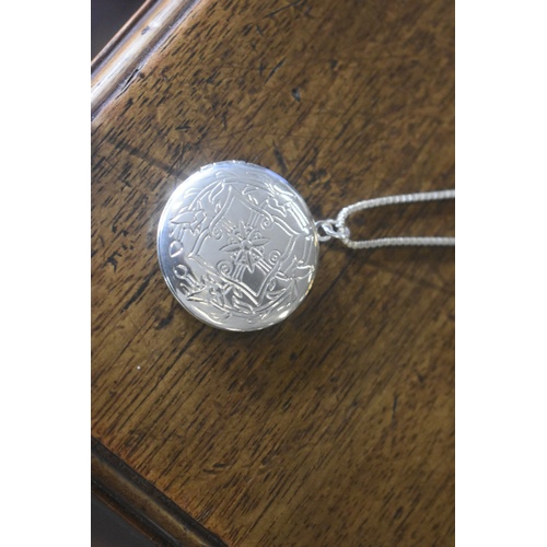 147 - NEW SILVER CHAIN AND SILVER LOCKET