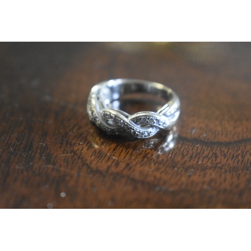 196 - 18ct DIAMOND TWIST RING