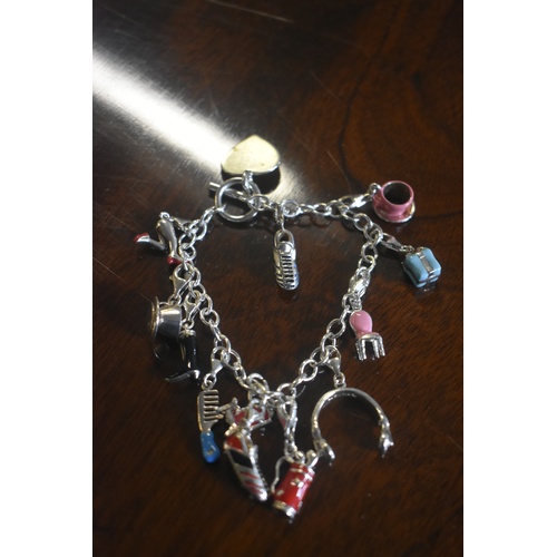 201 - SILVER CHARM BRACELET WITH 12 EBANEL CHARMS