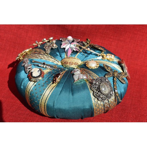 88 - VINTAGE PIN CUSHION WITH BROOCHES AND 3 ANTIQUE TIE PINS