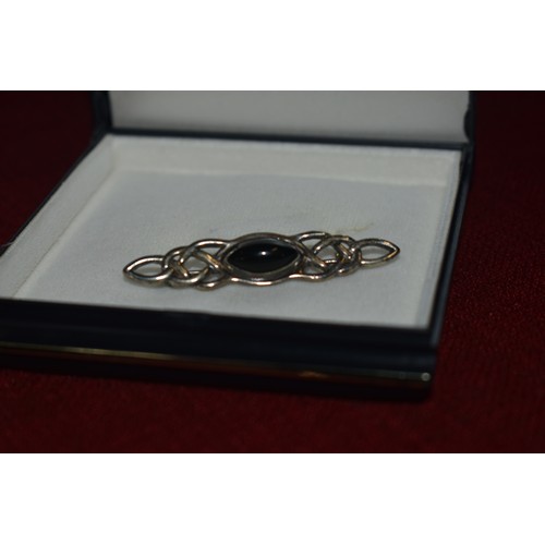 123 - SILVER BROOCH WITH ONYX