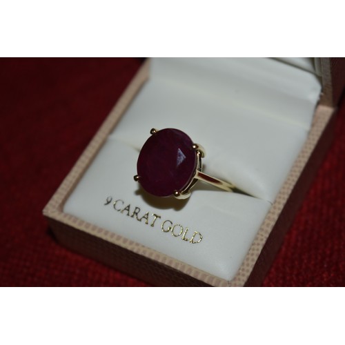 144 - 9CT GOLD AND RUBY RING