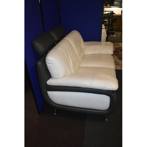 215 - CREAM AND BROWN LEATHER 2 SEATER SETTE WITH ADJUSTABLE HEAD RESTS