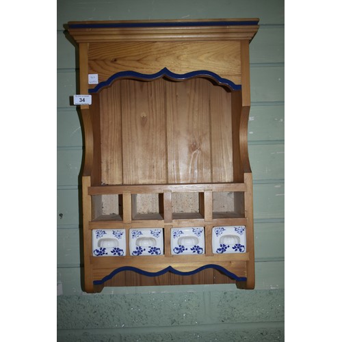 34 - SMALL PINE WALL RACK WITH PORCELAIN DRWAER FRONTS