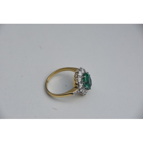 203 - 18CT GOLD EMERALD 2.2CT AND DIAMOND 1.35CT CLUSTER RING