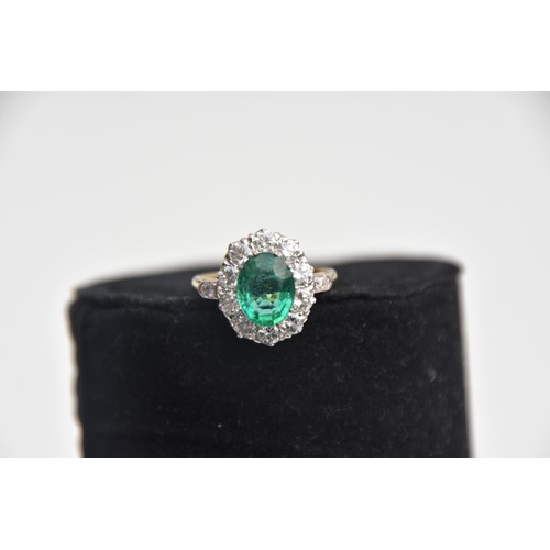 203 - 18CT GOLD EMERALD 2.2CT AND DIAMOND 1.35CT CLUSTER RING