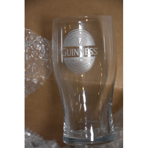 28 - LARGE QTY OF MIXED GLASSWARE INCLUDING GUINNESS, COKE ETC