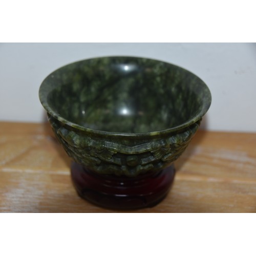 218 - JADE BOWL ON WOODEN STAND